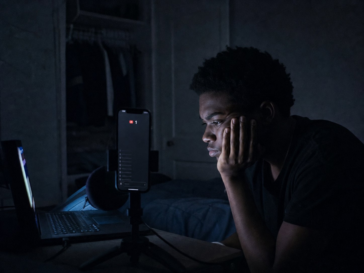 A creator streaming alone to an empty room at night